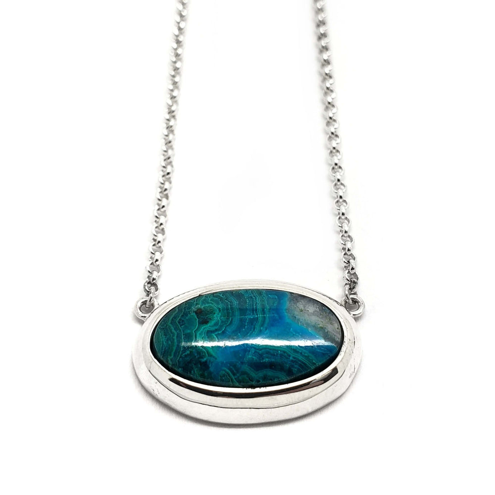 Sterling silver necklace with an oval green-blue malachite cabochon pendant