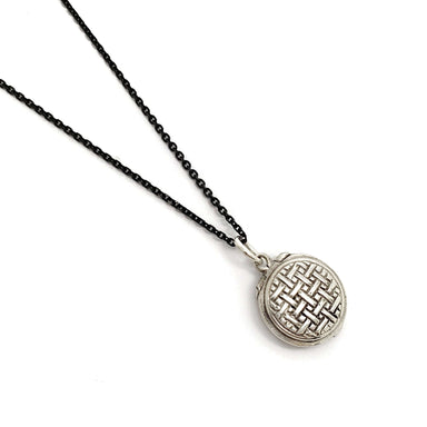 Sterling silver vintage locket with woven engraved pattern on black chain