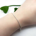 Sterling silver wheat chain bracelet worn on wrist