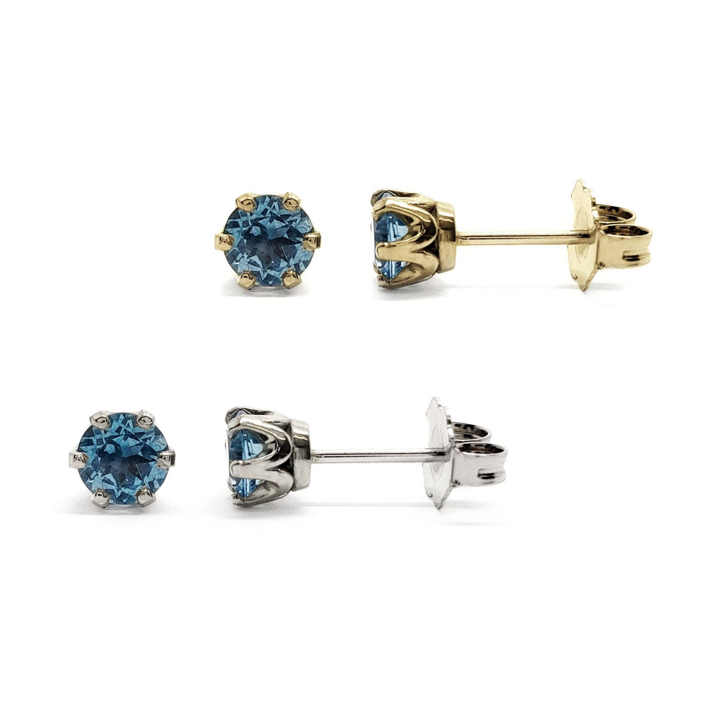 Swiss blue topaz six-prong stud earrings in 14kt yellow and white gold