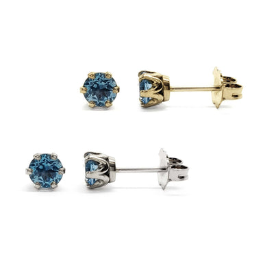 Swiss blue topaz six-prong stud earrings in 14kt yellow and white gold