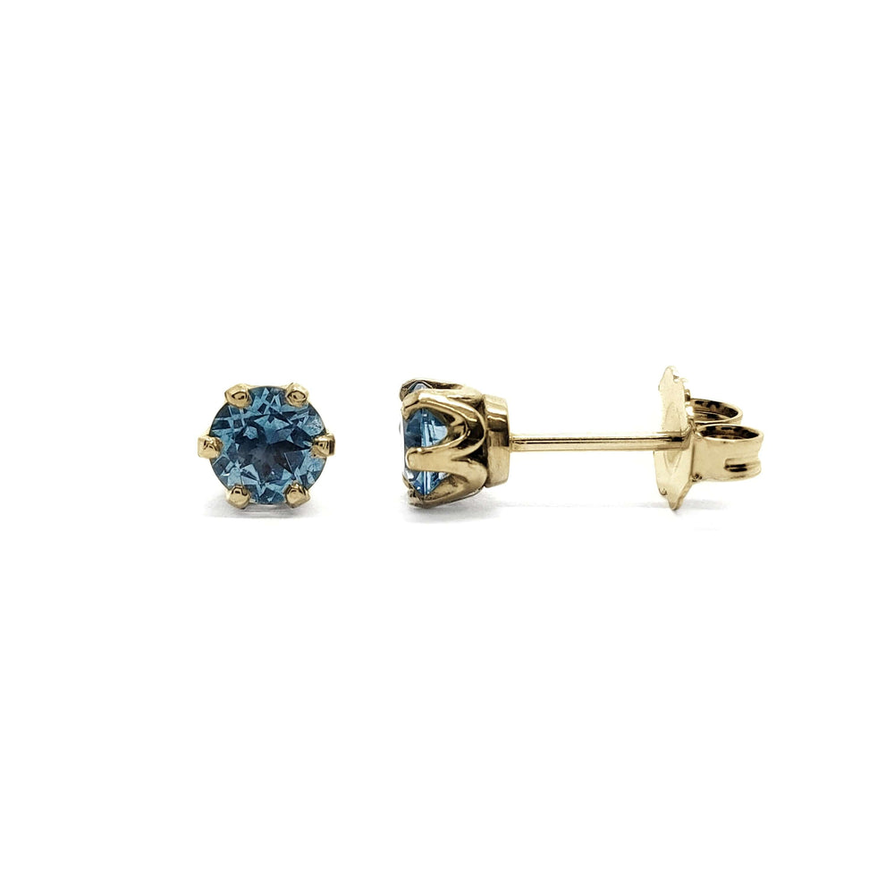 Swiss blue topaz six-prong stud earrings in 14kt yellow gold