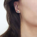Swiss blue topaz stud earring worn on ear