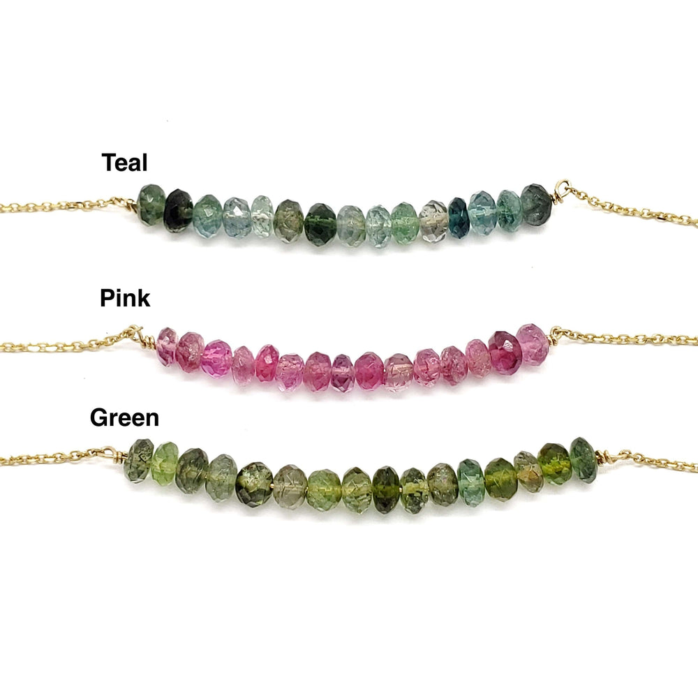 Teal, pink, and green tourmaline bead bar necklaces with labels on white background