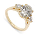 Three-stone engagement ring in 14kt yellow gold with oval lab-grown diamond and two round lab diamonds