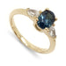 Three-stone engagement ring in 14kt yellow gold with oval blue sapphire and pear lab diamonds