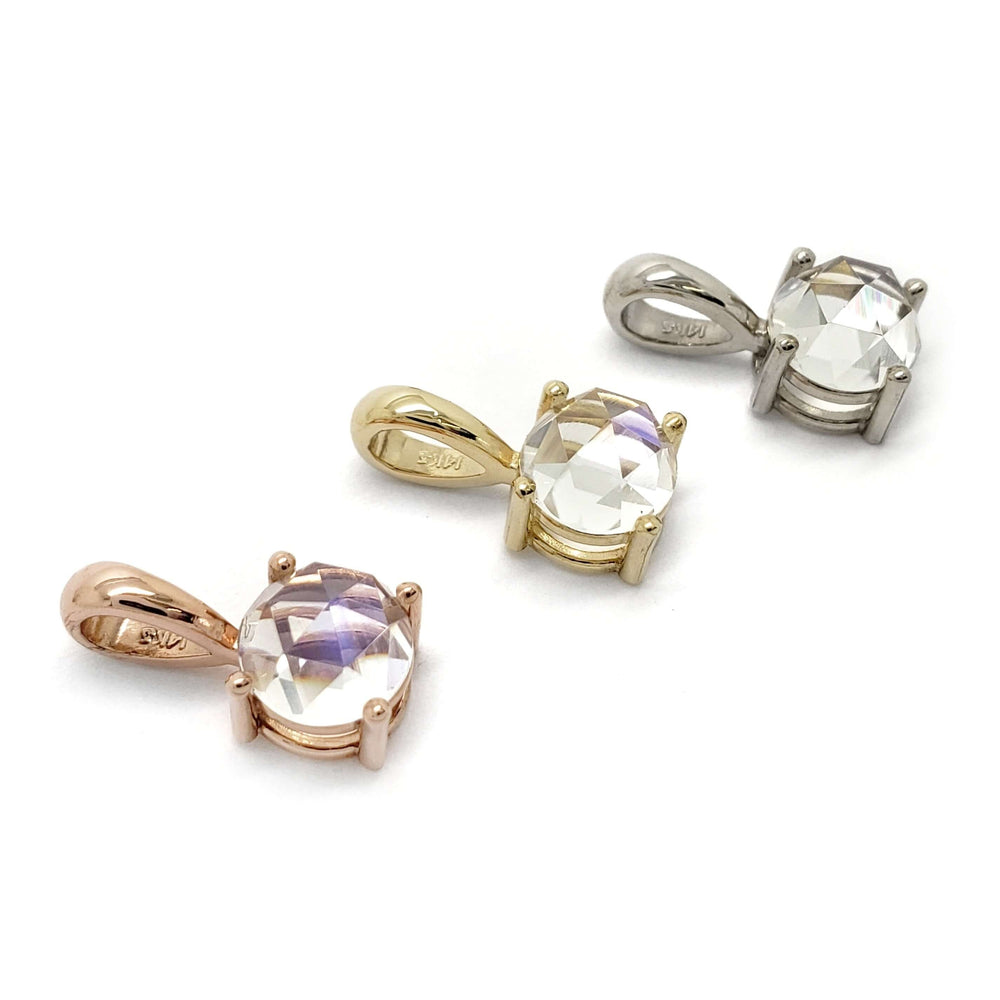 Three rose cut moonstone pendants in 14kt yellow, rose, and white gold on white background