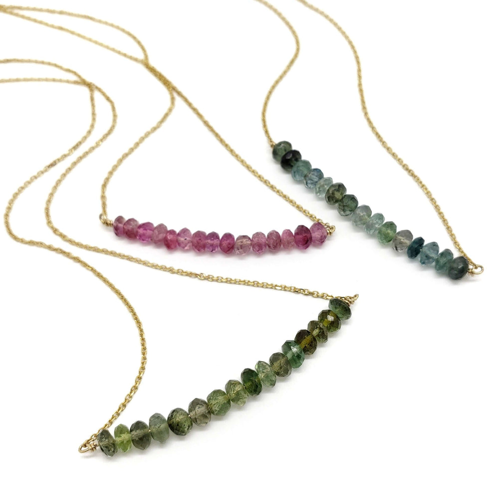 Three 14kt yellow gold necklaces with teal, pink, and green tourmaline bead bars