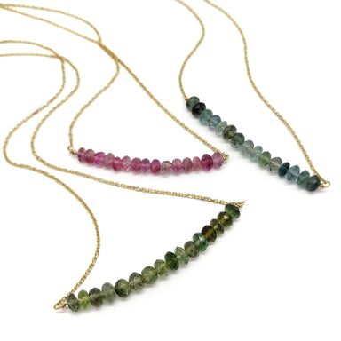 Three 14kt yellow gold necklaces with teal, pink, and green tourmaline bead bars