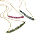 Three 14kt yellow gold necklaces with teal, pink, and green tourmaline bead bars