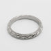 Top view of 14kt white gold wedding ring with wheat engraving and millgrain edge