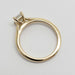 Overhead view of 14kt yellow gold solitaire ring with emerald cut lab diamond