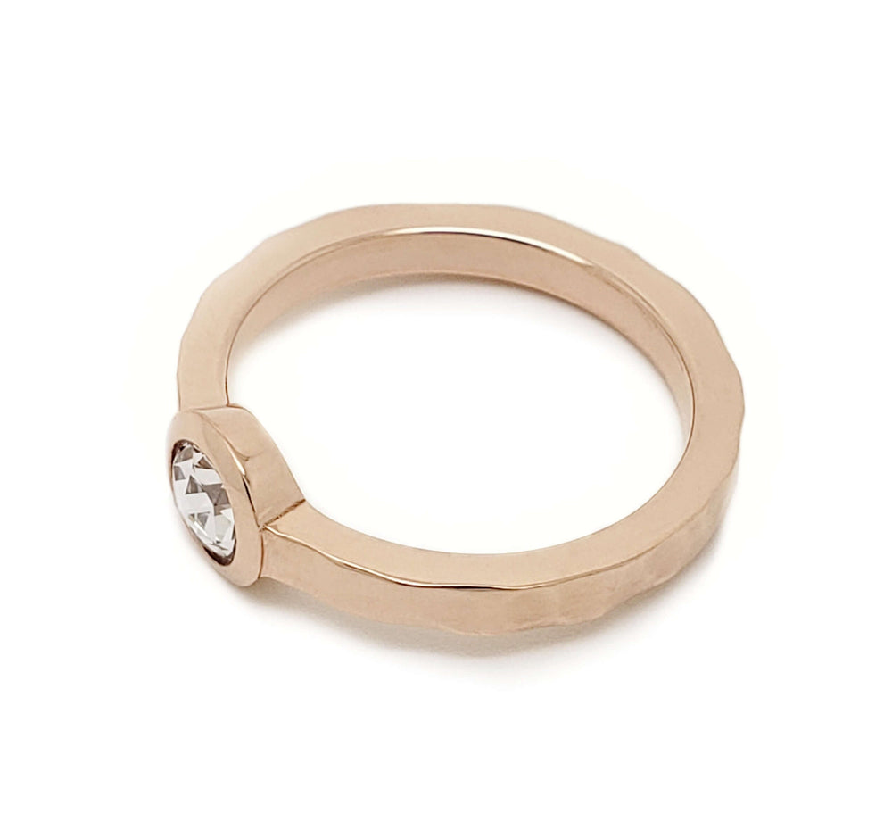 Top view of hammered 14kt rose gold ring with bezel-set rose cut diamond