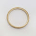 Top view of handcrafted 14kt yellow gold wedding ring with engraved wheat design