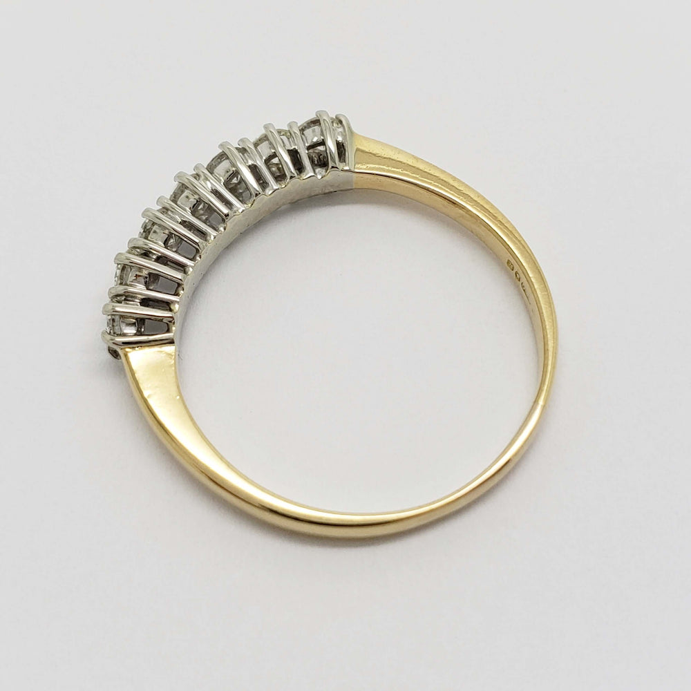 Top view of vintage seven-stone diamond ring in 18kt yellow and white gold
