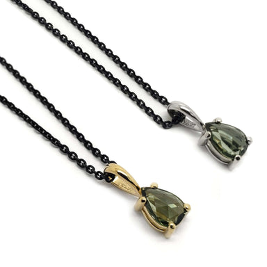 Two pear rose cut green sapphire pendants in 14k yellow and white gold on black chains