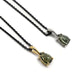 Two pear rose cut green sapphire pendants in 14k yellow and white gold on black chains
