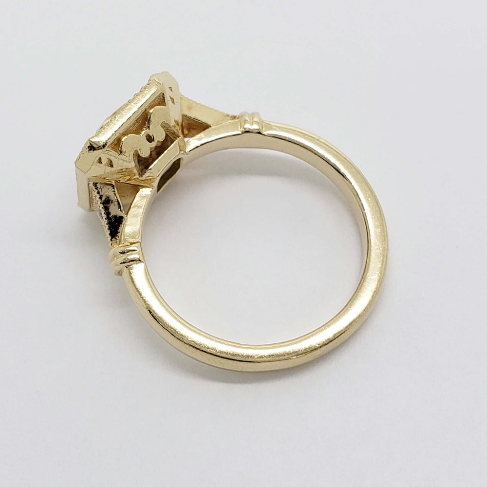 Underside of 14kt yellow gold engagement ring showing detailed gallery work