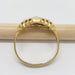 Underside of antique 18kt yellow gold diamond ring showing engraved details