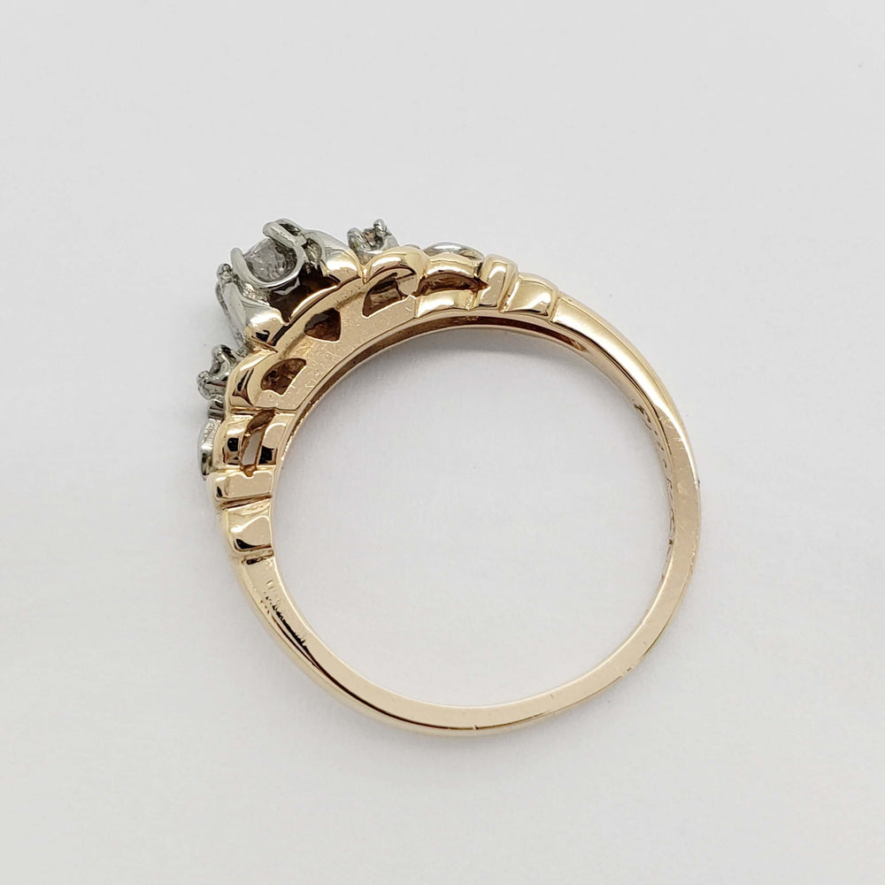 Underside view of antique yellow and white gold diamond ring band