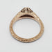 Underside view of 14k rose gold ring showing engraved band and filigree gallery