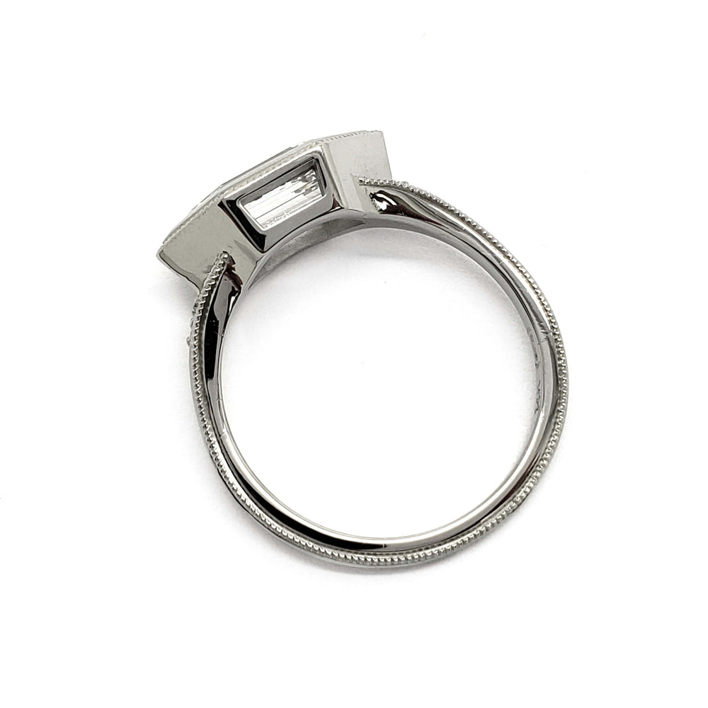 Underside of 14kt white gold ring showing bezel setting of hexagon lab diamond