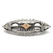 Victorian two-tone silver and rose gold pin with ornate scrollwork and engraved detail