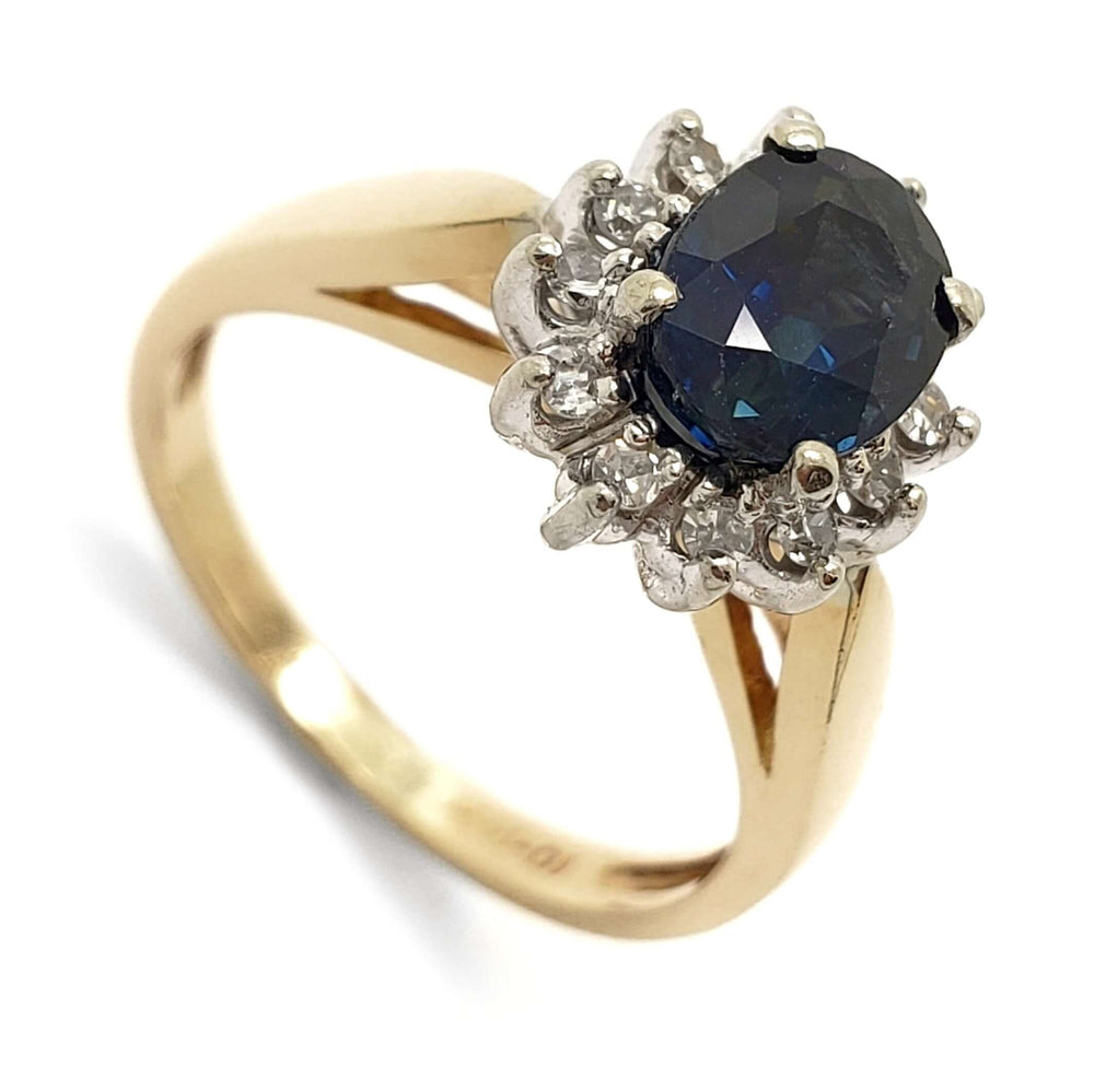 Vintage-inspired sapphire and diamond halo ring in 14kt yellow and 10kt white gold