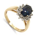 Vintage-inspired sapphire and diamond halo ring in 14kt yellow and 10kt white gold