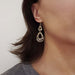 Vintage 10kt gold filigree dangle earring worn on ear