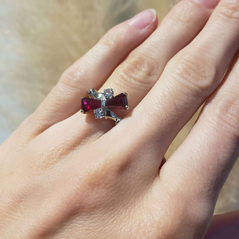 Vintage 10kt white gold cocktail ring with red glass and cubic zirconia shown on hand