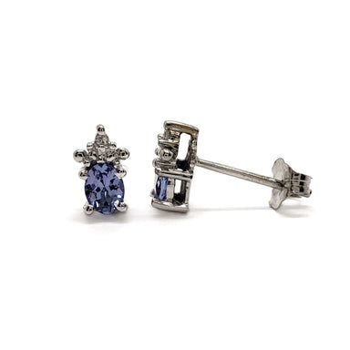 Pair of vintage 10kt white gold stud earrings with oval tanzanite and diamond accents