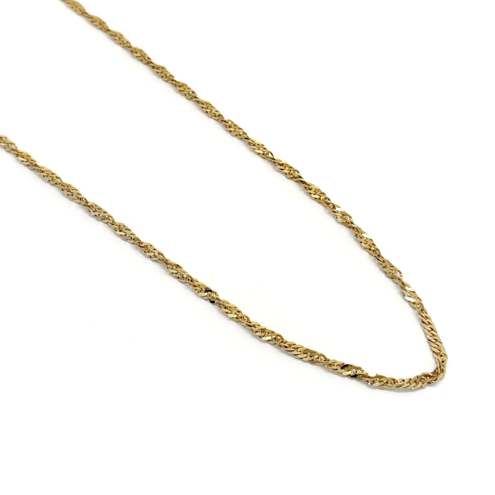 Close-up of vintage 10kt yellow gold twist chain necklace