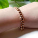 Vintage 14K rose gold curb link bracelet worn on a wrist