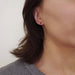 Vintage 14kt yellow gold red spinel stud earring worn on ear