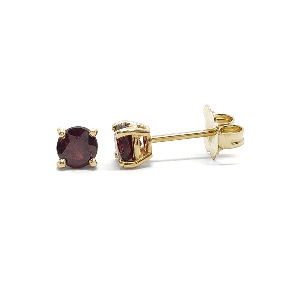 Pair of vintage 14kt yellow gold stud earrings with round deep red spinel gemstones