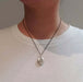 Vintage sterling silver oval locket necklace worn on a model