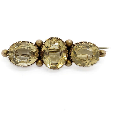 Vintage brooch with three oval faceted citrine gemstones set in yellow gold
