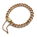Vintage curb link bracelet in 14K rose gold with a squared clasp and safety chain