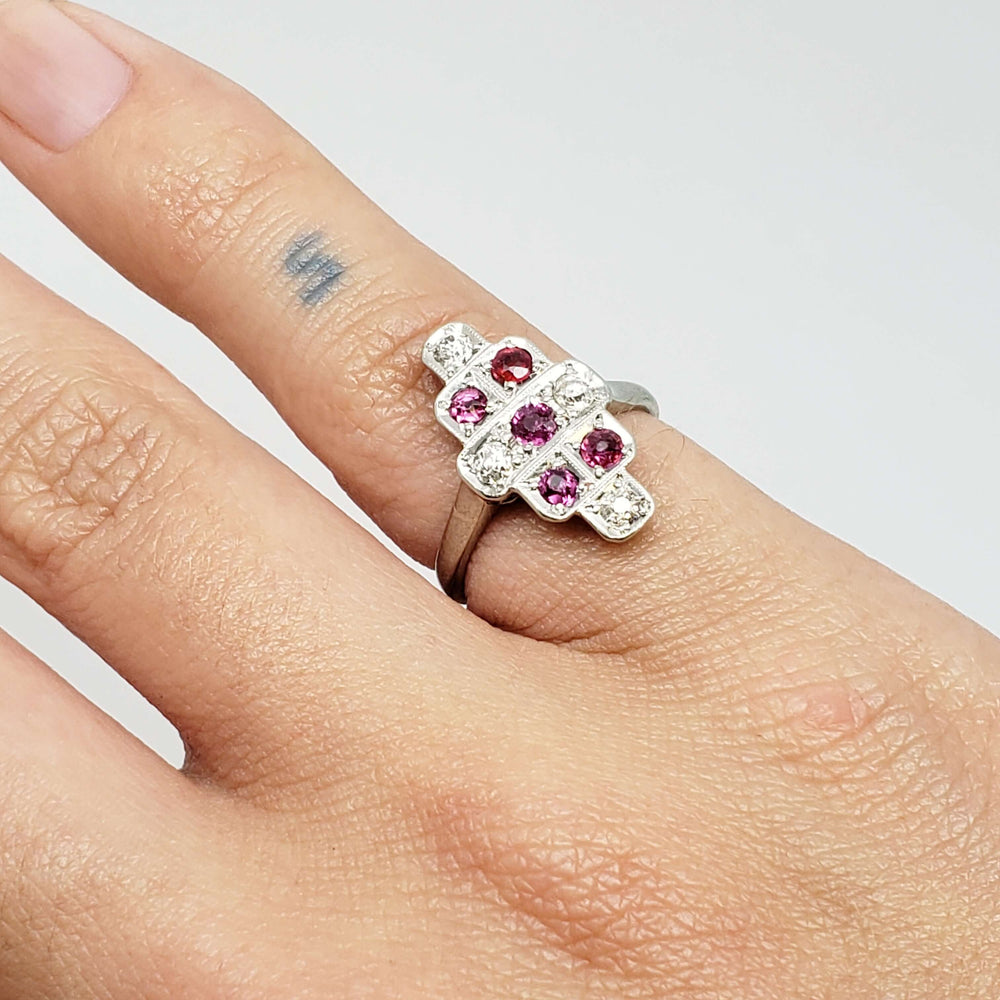 Vintage ruby and diamond ring in white gold shown on hand