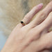 Vintage sapphire and diamond pinky ring in yellow gold shown on a hand