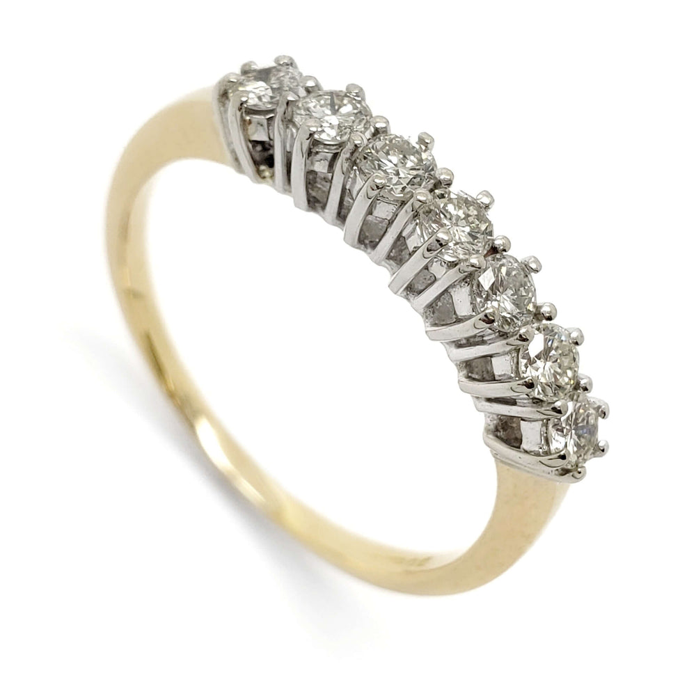 Vintage seven-stone diamond ring in 18kt yellow and white gold, angled view