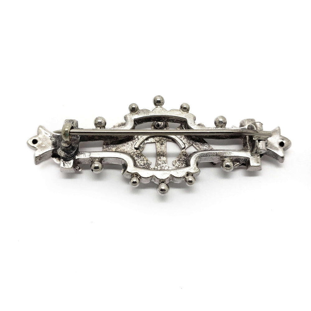 Back view of vintage silver and rose gold Faith-Hope-Charity pin showing clasp