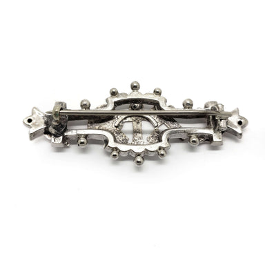 Back view of vintage silver and rose gold Faith-Hope-Charity pin showing clasp