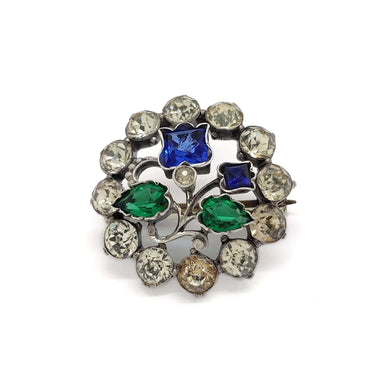 Vintage sterling silver brooch with round clear, blue, and green glass stones in a floral design