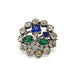 Vintage sterling silver brooch with round clear, blue, and green glass stones in a floral design