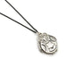 Vintage sterling silver round locket with ornate engraving on a black chain