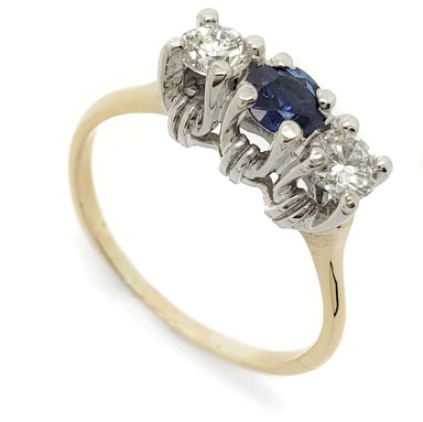 Vintage three-stone ring with blue sapphire and two diamonds in 14kt yellow and white gold