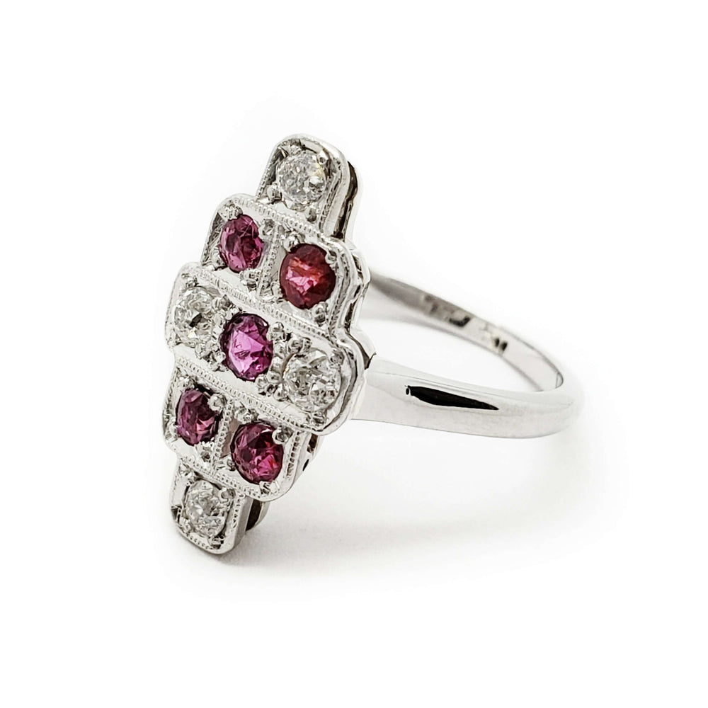 Side angle of vintage white gold ring with rubies and diamonds