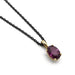 Oval violet garnet pendant in 14kt yellow gold on a black chain, shown on white background